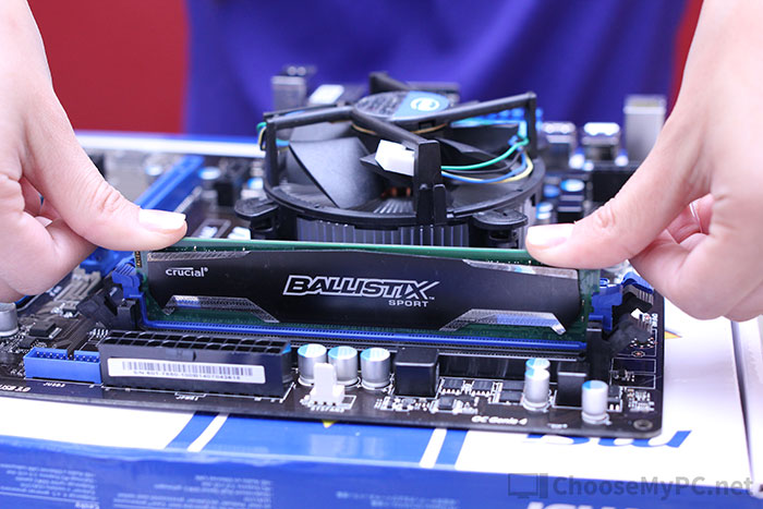 Pushing the RAM into the slot