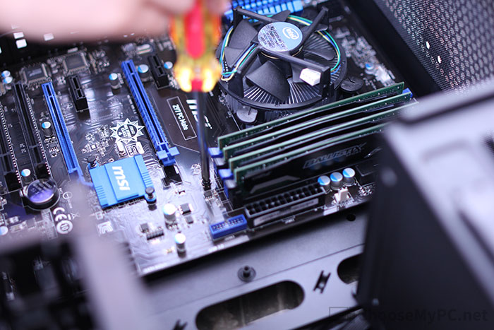 Screwing in the motherboard